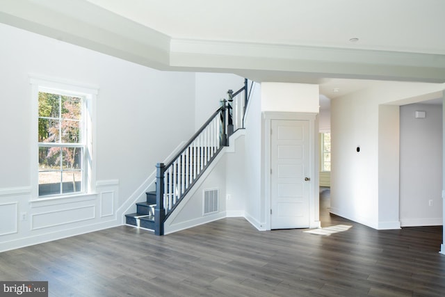 interior space featuring ornamental molding and hardwood / wood-style floors