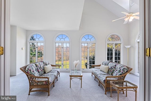 sunroom / solarium featuring vaulted ceiling, ceiling fan, and french doors