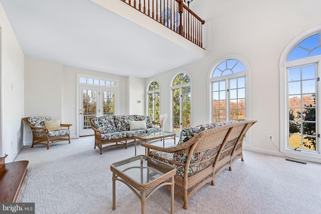 sunroom featuring french doors and plenty of natural light