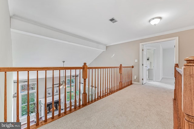 hallway with light carpet, lofted ceiling with beams, and ornamental molding