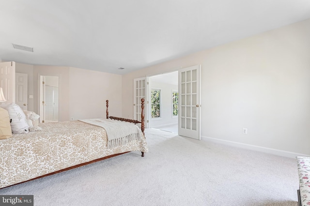 carpeted bedroom featuring french doors