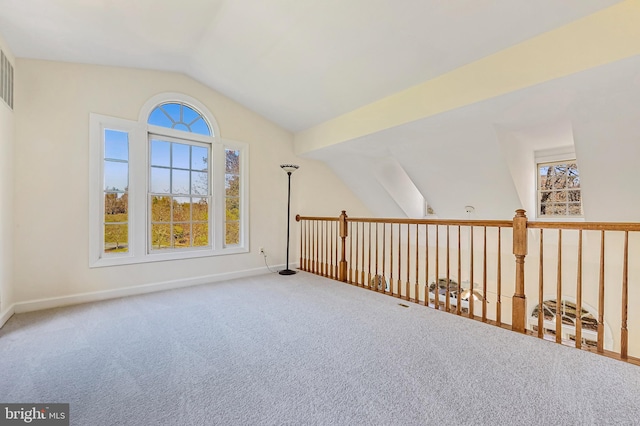 bonus room with carpet floors and lofted ceiling