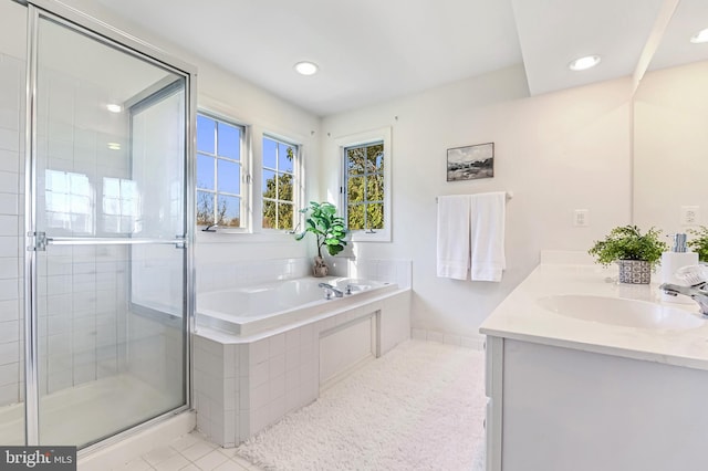 bathroom with vanity, separate shower and tub, and tile patterned floors