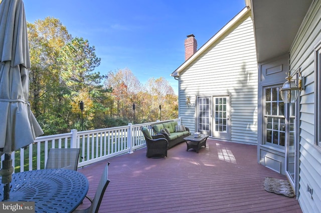 wooden deck featuring outdoor lounge area