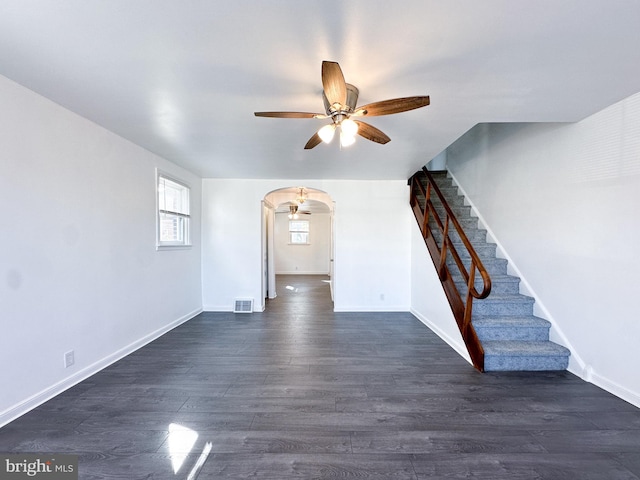 interior space featuring ceiling fan and dark hardwood / wood-style floors