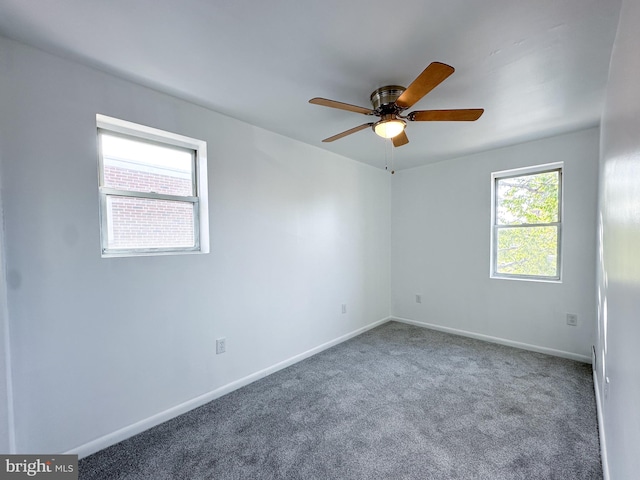 unfurnished room with carpet floors and ceiling fan