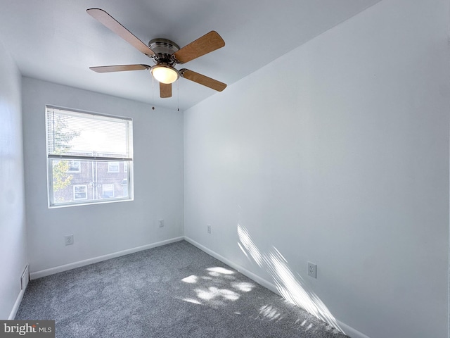 unfurnished room featuring carpet and ceiling fan