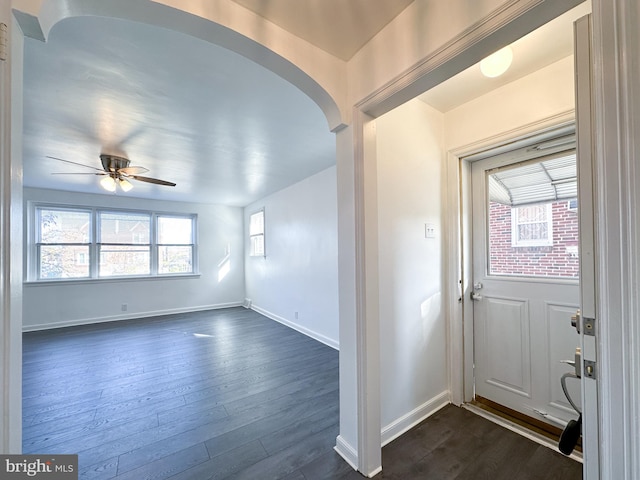 foyer entrance featuring ceiling fan and dark hardwood / wood-style floors