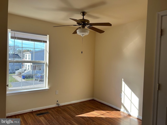 spare room featuring ceiling fan and hardwood / wood-style floors