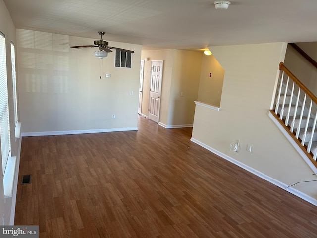 unfurnished room featuring ceiling fan and dark hardwood / wood-style flooring