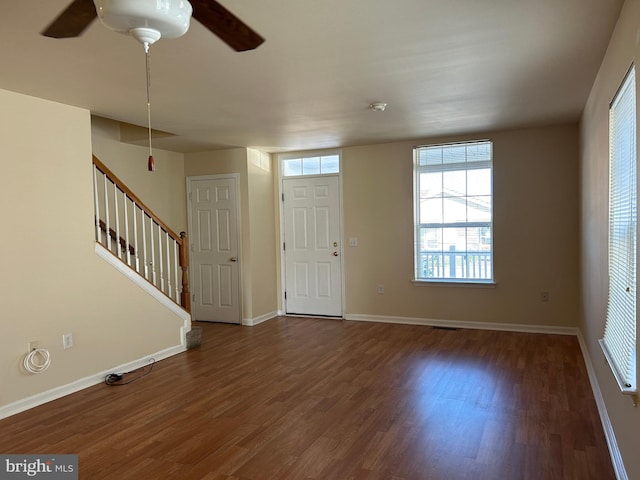 entryway featuring ceiling fan and dark hardwood / wood-style flooring