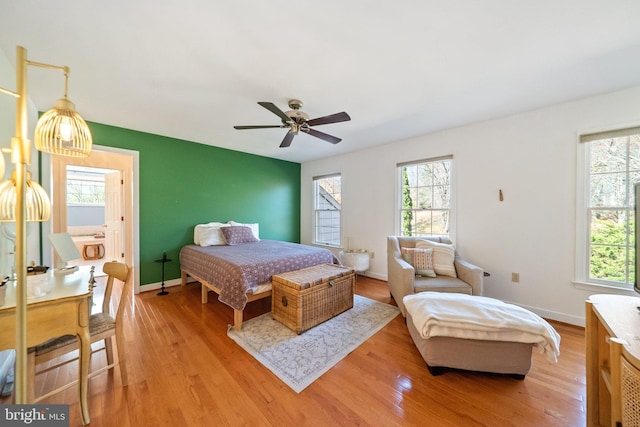 bedroom with hardwood / wood-style flooring and ceiling fan