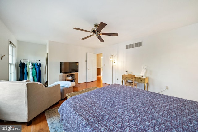 bedroom with ceiling fan and light hardwood / wood-style flooring