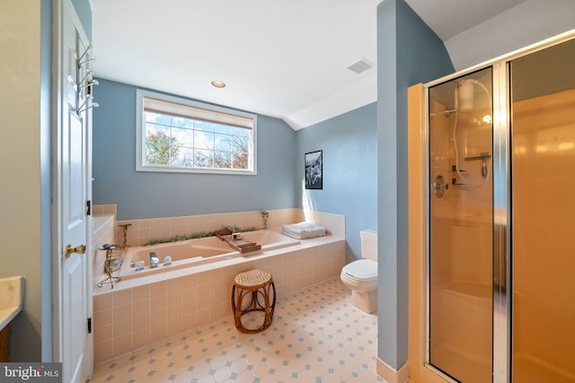 bathroom featuring shower with separate bathtub, lofted ceiling, and toilet