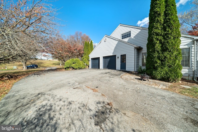 view of home's exterior with a garage