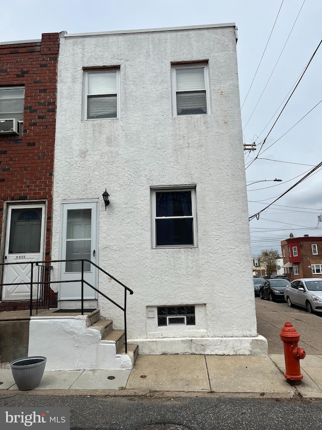 view of front of home featuring cooling unit