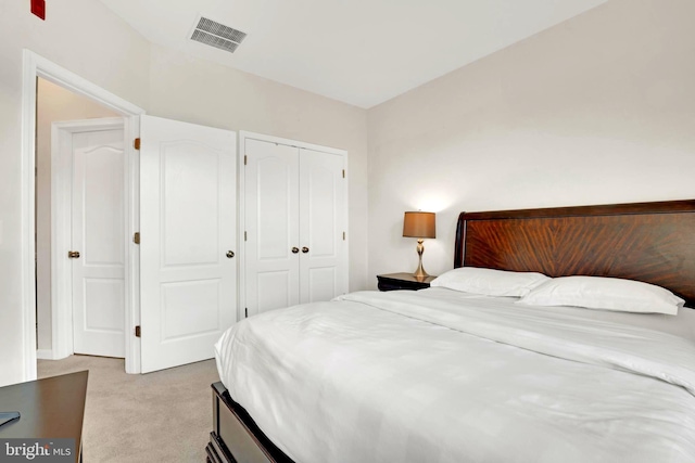 carpeted bedroom with a closet