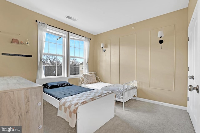 bedroom featuring light colored carpet