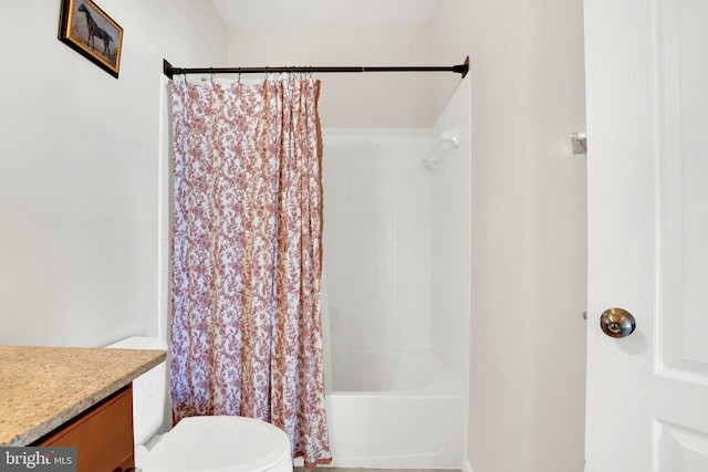 full bathroom featuring toilet, vanity, and shower / tub combo with curtain