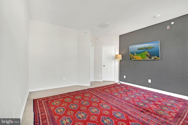 empty room featuring carpet flooring