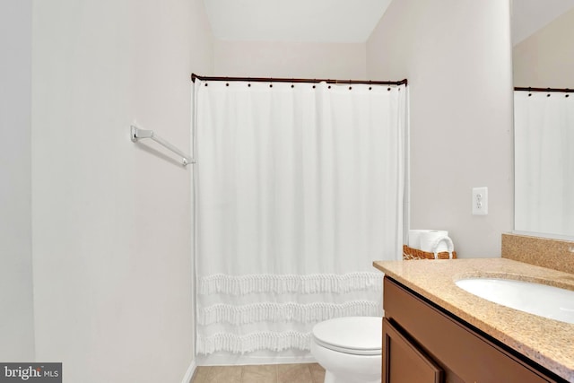 bathroom with tile patterned floors, vanity, and toilet