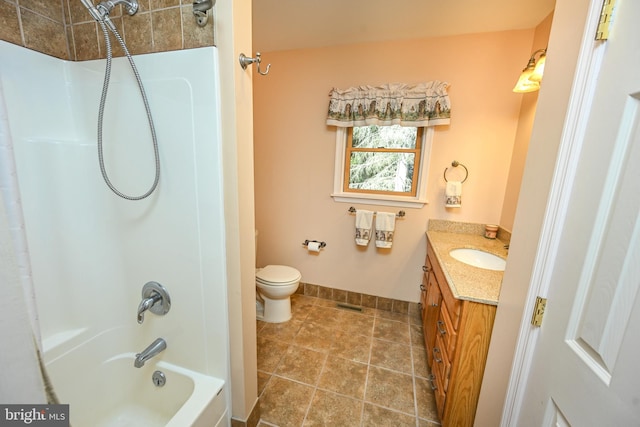 full bathroom with tile patterned flooring, vanity, toilet, and tiled shower / bath combo