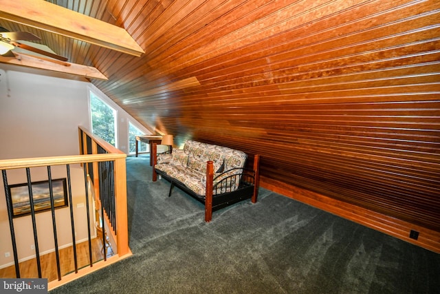 unfurnished room featuring dark carpet, wood ceiling, and vaulted ceiling