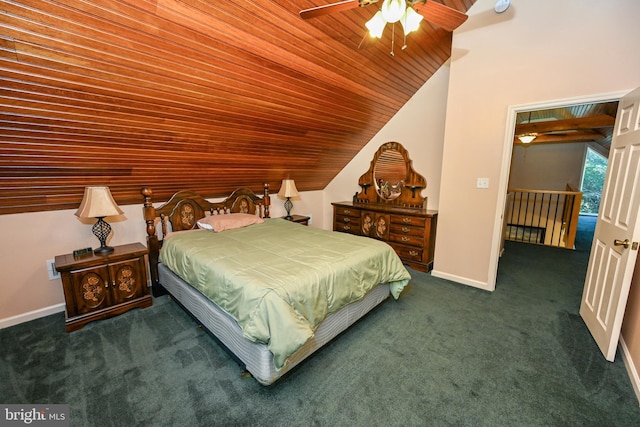 bedroom featuring dark colored carpet, ceiling fan, wooden ceiling, and vaulted ceiling