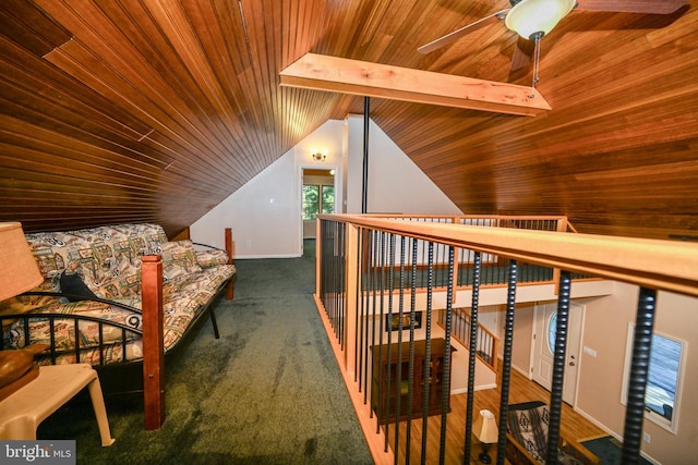 additional living space featuring vaulted ceiling with beams, ceiling fan, and wooden ceiling