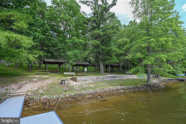 exterior space featuring a gazebo and a water view