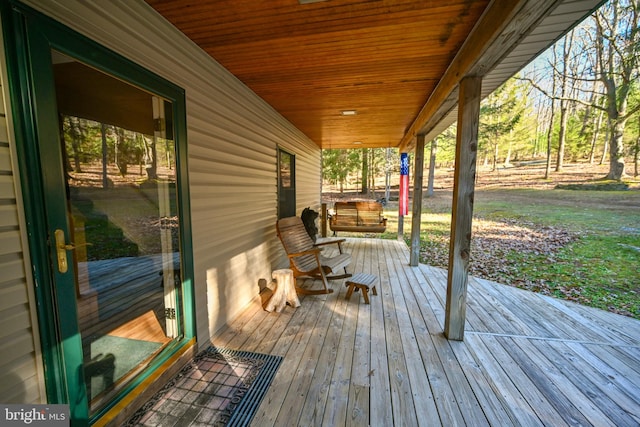 wooden terrace with a porch