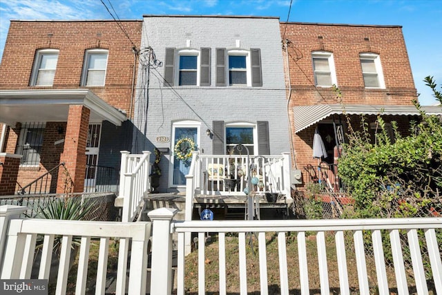 view of property featuring a porch