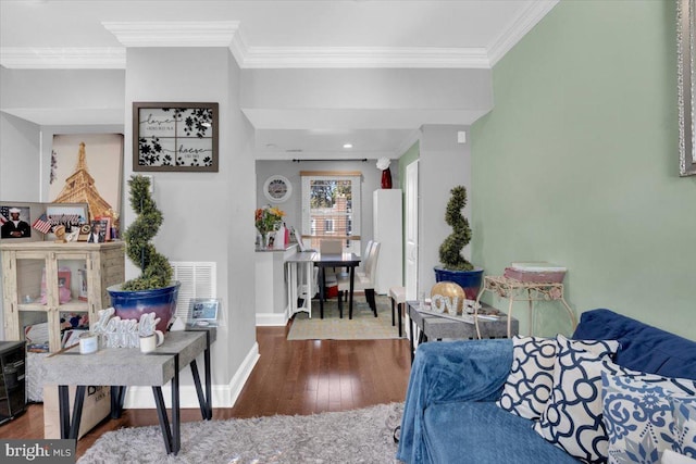 bedroom with dark hardwood / wood-style flooring and ornamental molding