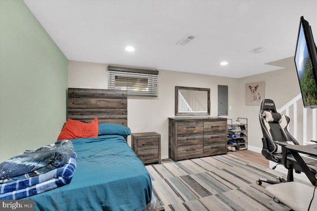 bedroom with light wood-type flooring