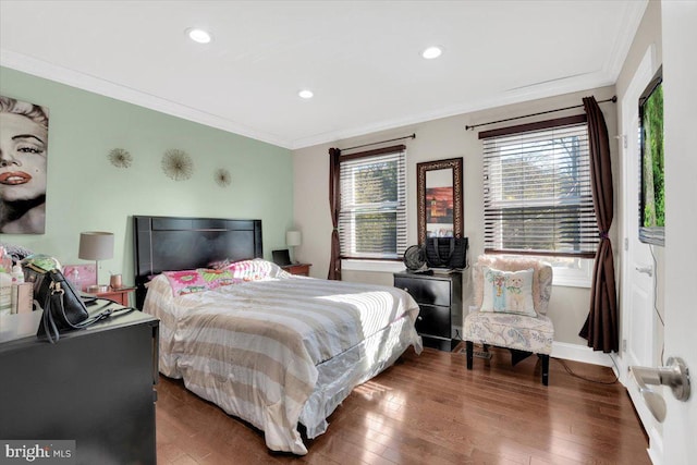 bedroom featuring dark hardwood / wood-style flooring and ornamental molding