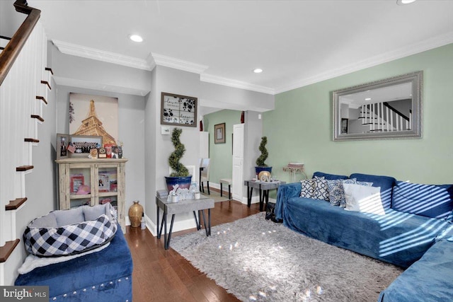 living room with dark hardwood / wood-style floors and crown molding