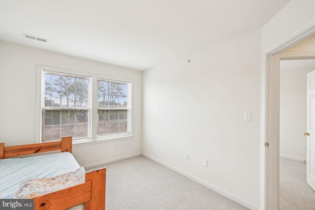 bedroom with light carpet