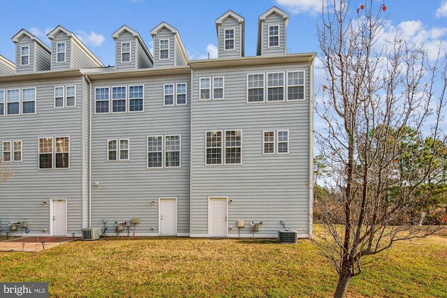 view of home's exterior with a yard and central AC unit