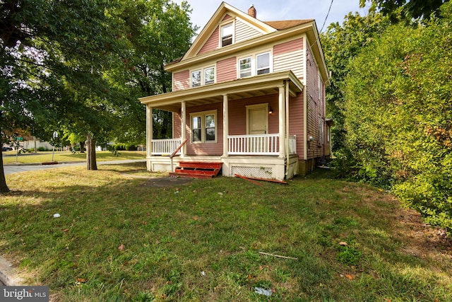 view of front of home with a front lawn and covered porch