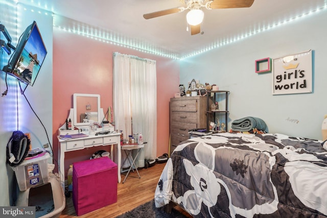 bedroom with ceiling fan and light hardwood / wood-style flooring