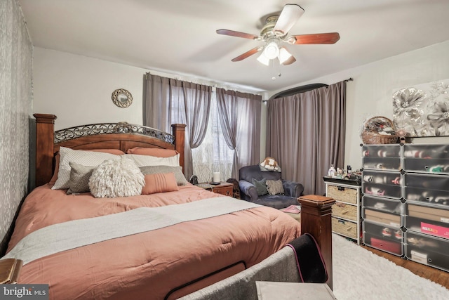 bedroom featuring wood-type flooring and ceiling fan