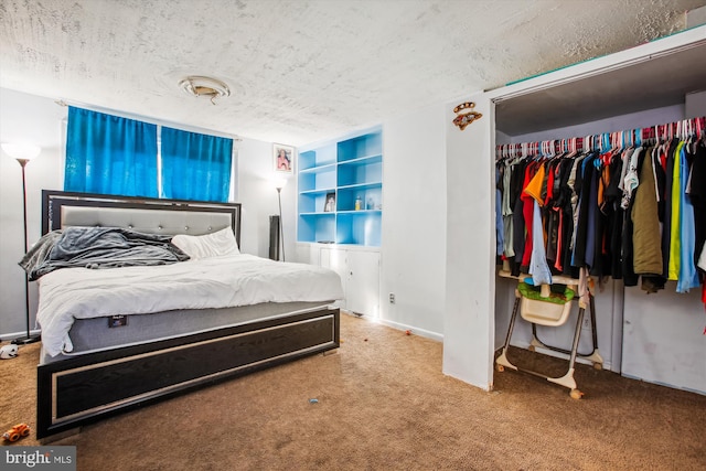 bedroom with carpet floors, a textured ceiling, and a closet