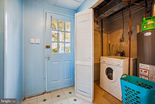 washroom featuring washer / dryer and water heater