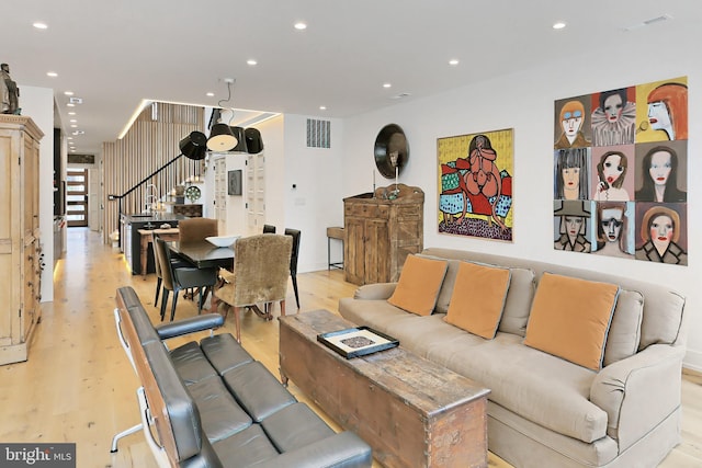 living room with light hardwood / wood-style flooring