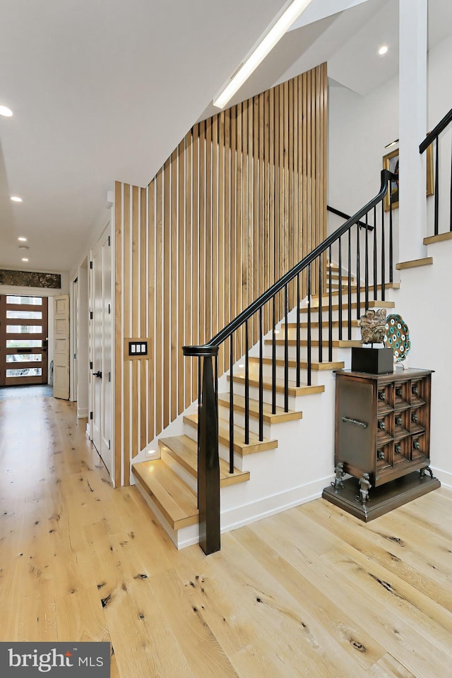 stairs with wood-type flooring