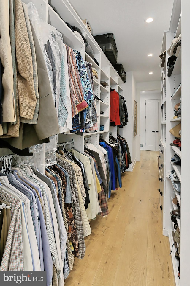 walk in closet featuring light hardwood / wood-style floors