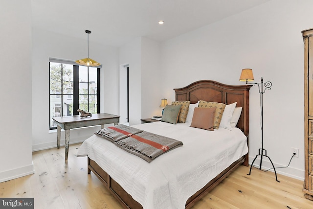 bedroom with light hardwood / wood-style floors