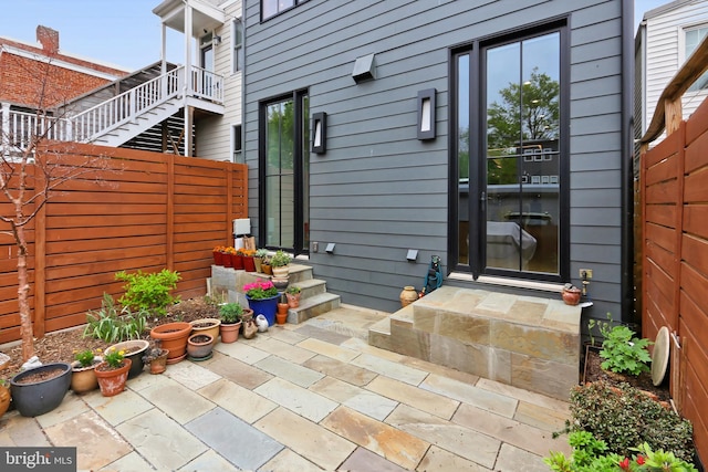 entrance to property featuring a patio area