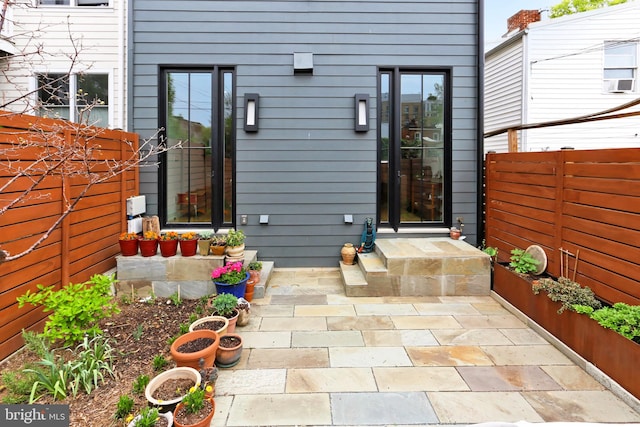 property entrance with a patio area