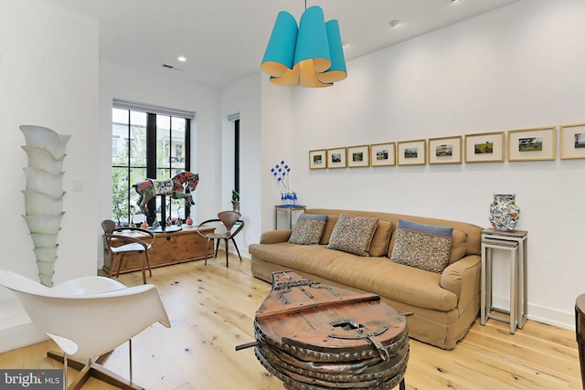 living room featuring french doors and light hardwood / wood-style floors